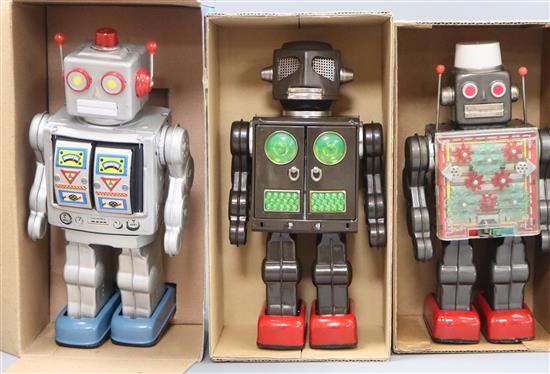 A Horikawa, Japan battery-operated Machine Robot and two other robots,